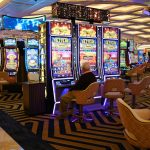 a casino room filled with lots of slot machines