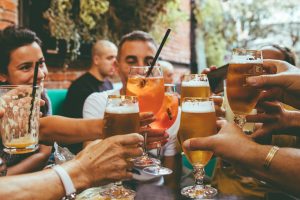 Home 13 people holding drinks during day