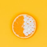 orange fruit slices on yellow surface