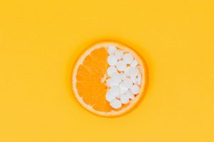 Home 1 orange fruit slices on yellow surface