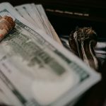 a pile of money sitting on top of a table
